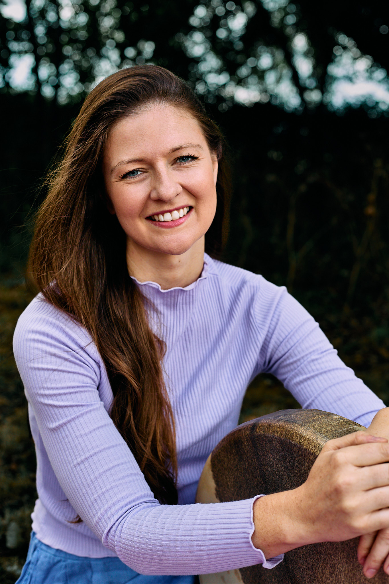 Esther Wilson holding a frame drum